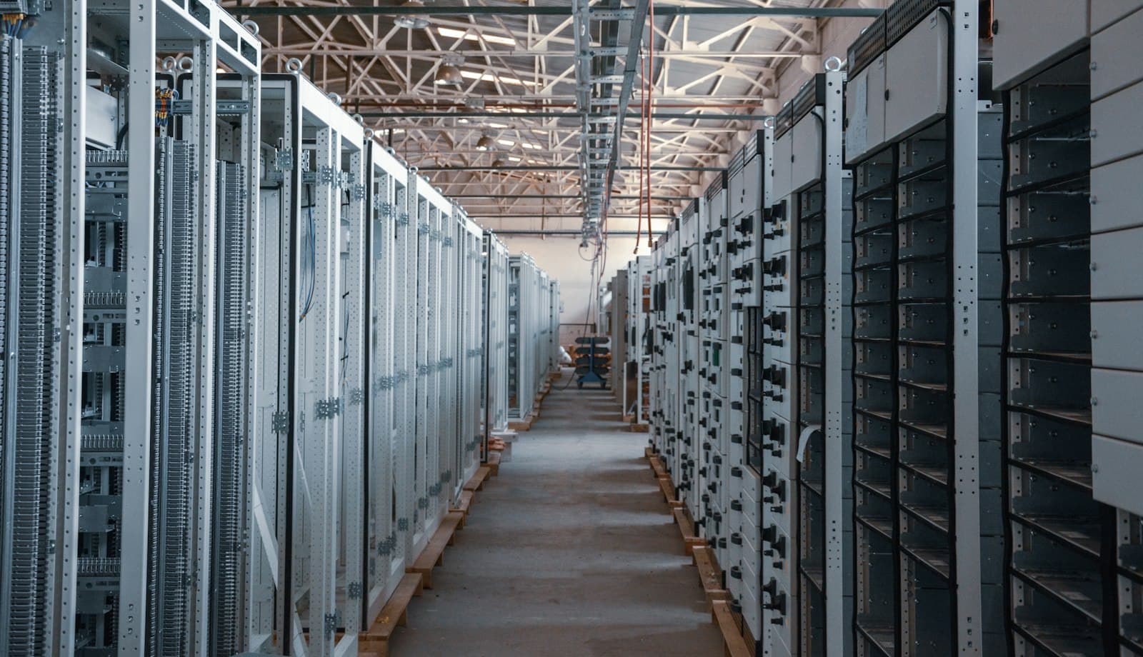 An aisle of equipment racks in a data center