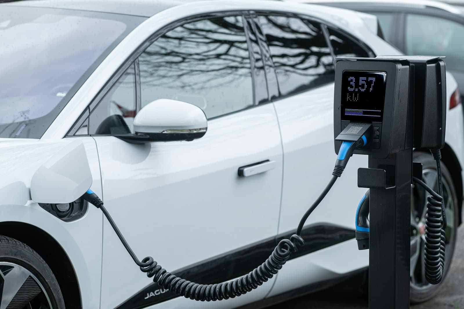 An electric car charging at a station